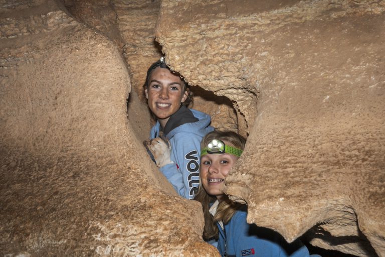 two girls spelunking