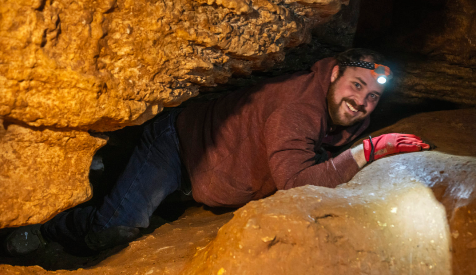 adult male underground caving